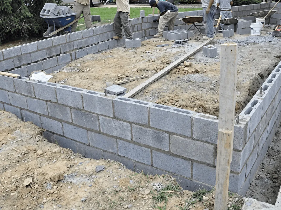 Professionals building a foundation with blocks in Tucson, AZ