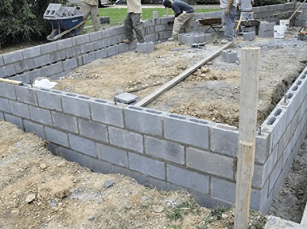Professionals building a foundation with blocks in Tucson, AZ