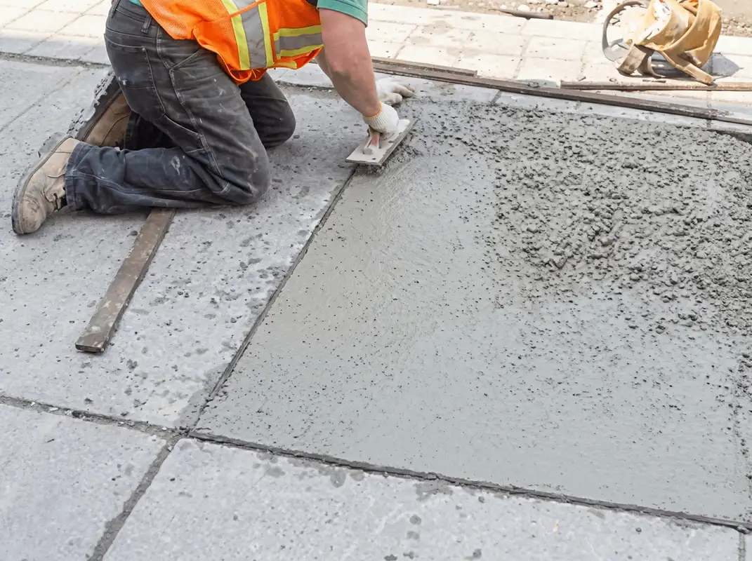 Professional repairing a concrete floor in Tucson, AZ