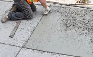 Professional repairing a concrete floor in Tucson, AZ